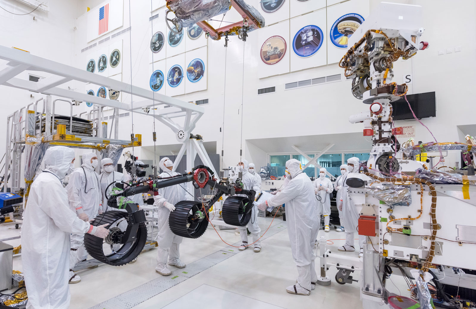 In this image, taken on June 13, 2019, engineers prepare the starboard legs and wheels — otherwise known as the mobility suspension — for integration onto NASA's Mars 2020 rover.