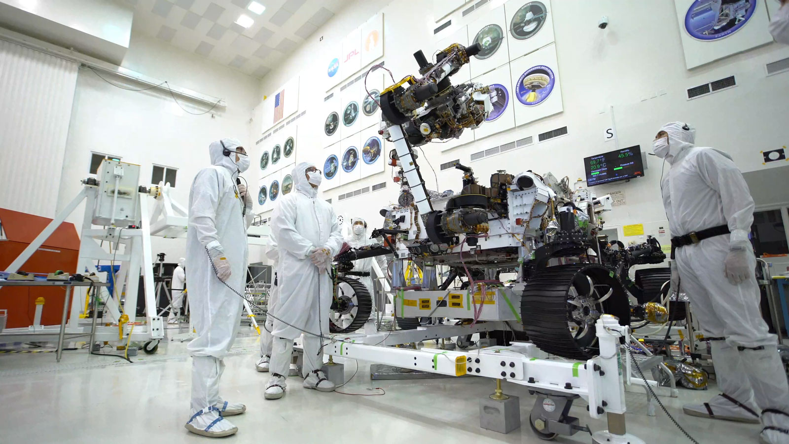 Photo taken in the clean room with the rover's 7-foot-long arm and its 88-pound sensor-laden turret as it moves from a deployed to a stowed configuration.