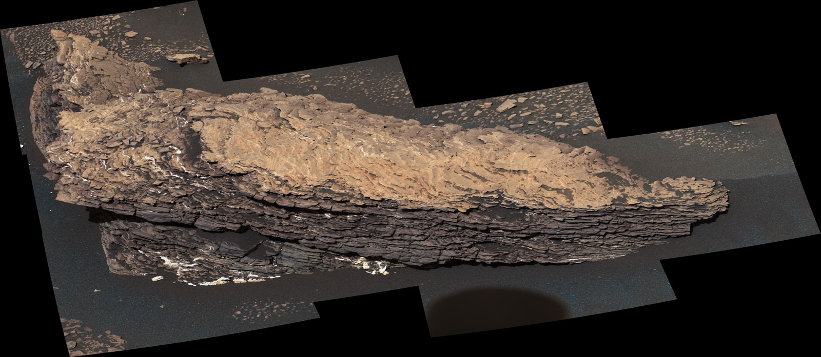 This mosaic of images shows a boulder-sized rock called "Strathdon," which is made up of many complex layers. NASA's Curiosity Mars rover took these images using its Mast Camera, or Mastcam, on July 9, 2019, the 2,461st Martian sol, or day, of the mission.