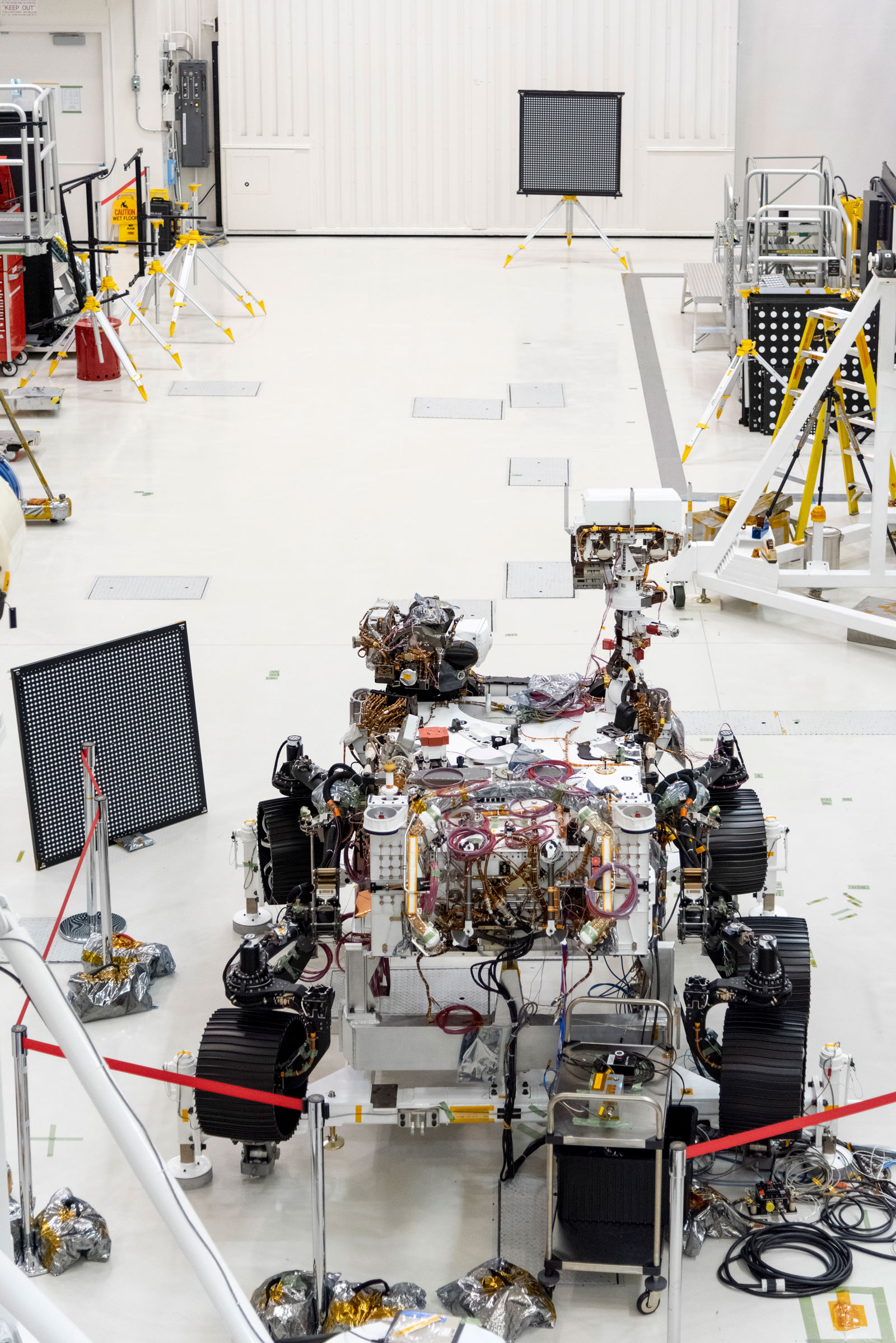 The Mars 2020 rover undergoes an "eye" exam after several cameras were installed. The rover carries everything from wide-angle landscape cameras to narrow-angle high-resolution zoom lens cameras. The image was taken on July 23, 2019, in the Spacecraft Assembly Facility's High Bay 1 at the Jet Propulsion Laboratory in Pasadena, California.