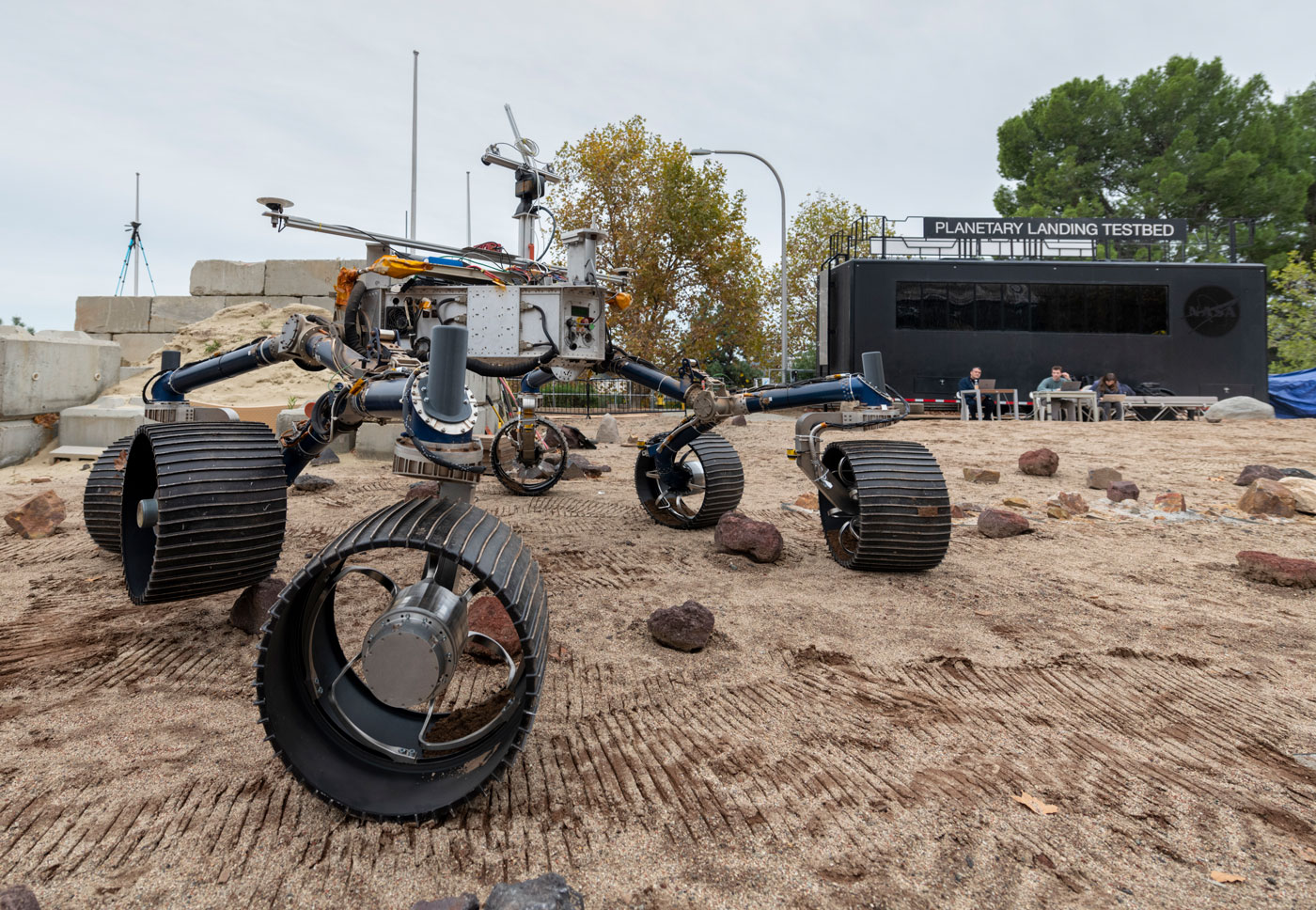 An engineering model of NASA's Mars 2020 rover makes tracks during a driving test in the Mars Yard, an area that simulates Mars-like conditions at NASA's Jet Propulsion Laboratory in Pasadena, California.