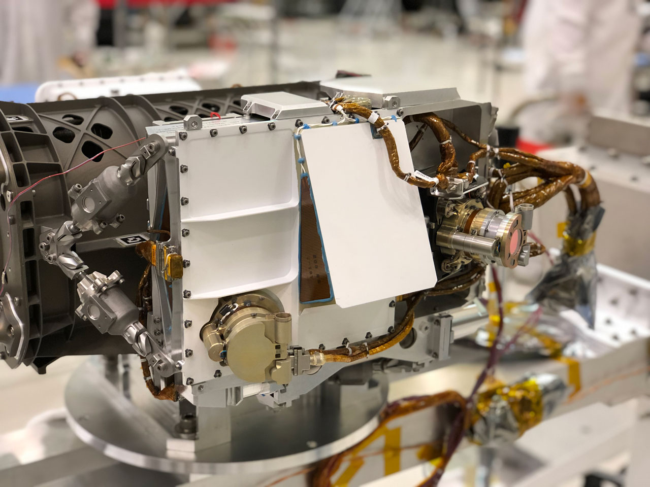The SHERLOC instrument is located at the end of the robotic arm on NASA's Mars 2020 rover.