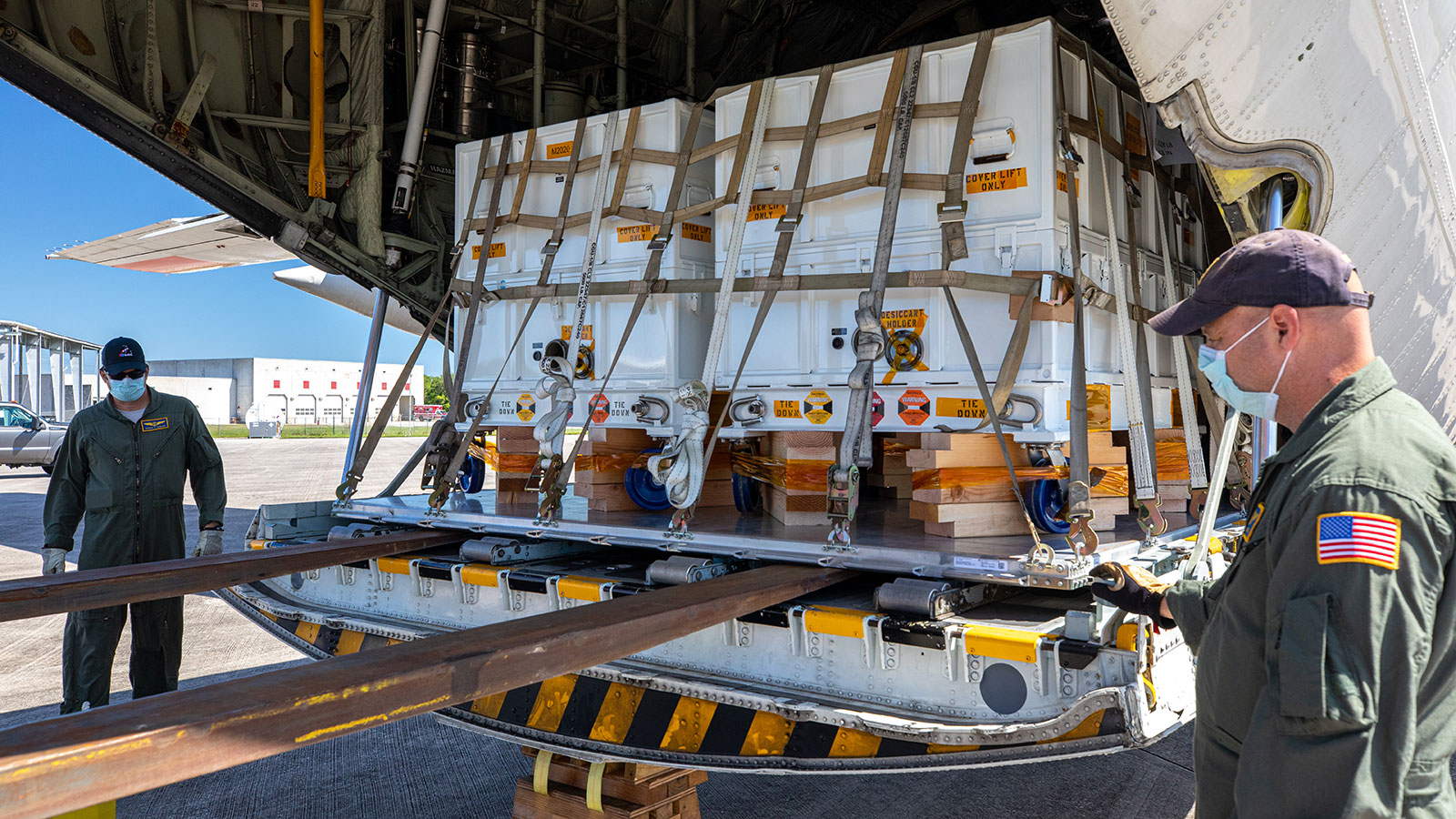Perseverance mission flight hardware, test gear and equipment delivered to Kennedy Space Center is unloaded from a NASA Wallops C-130.