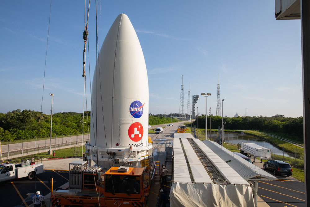 nose cone containing the Mars 2020 Perseverance rover sits atop a motorized payload transporter