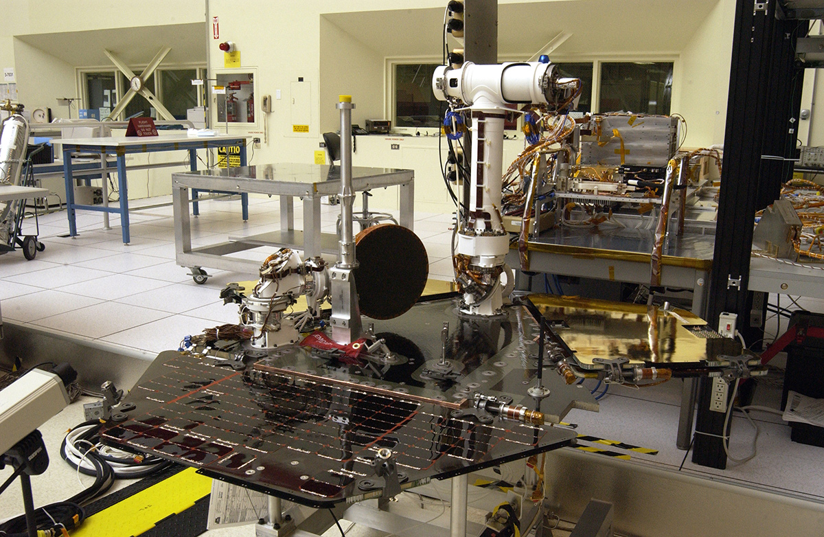 Rover 2 equipment deck, with solar arrays partially deployed, in JPL's Spacecraft Assembly Facility's cleanroom.