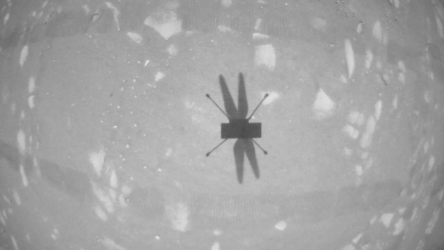 The Ingenuity Mars Helicopter’s navigation camera captures the helicopter’s shadow on the surface of Jezero Crater during rotorcraft’s second experimental test flight on April 22, 2021.