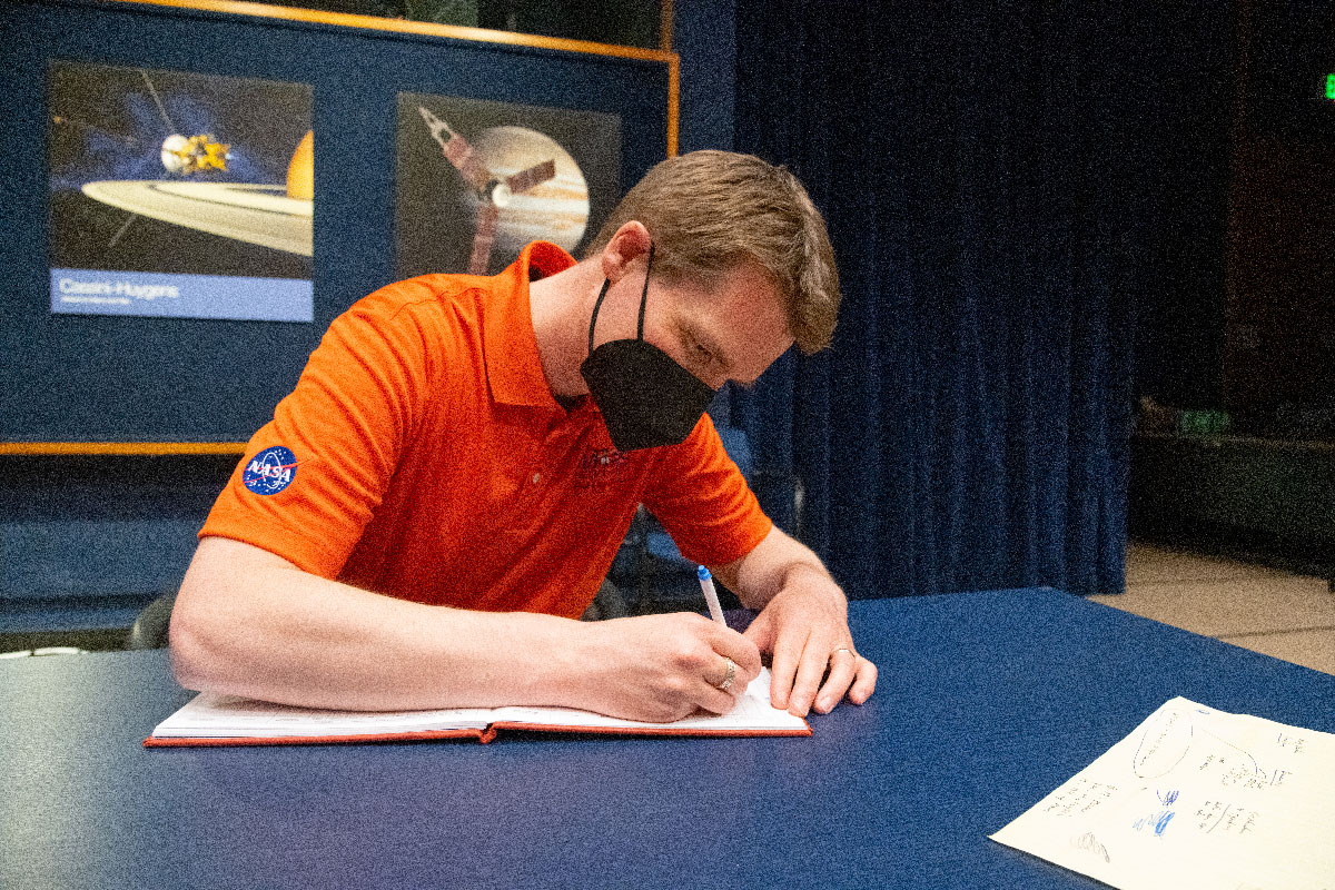 Ingenuity Mars chief pilot Håvard Grip records data of the first flight of the Ingenuity Mars Helicopter into the official pilot’s logbook for the project – the “Nominal Pilot’s Logbook for Planets and Moons.”