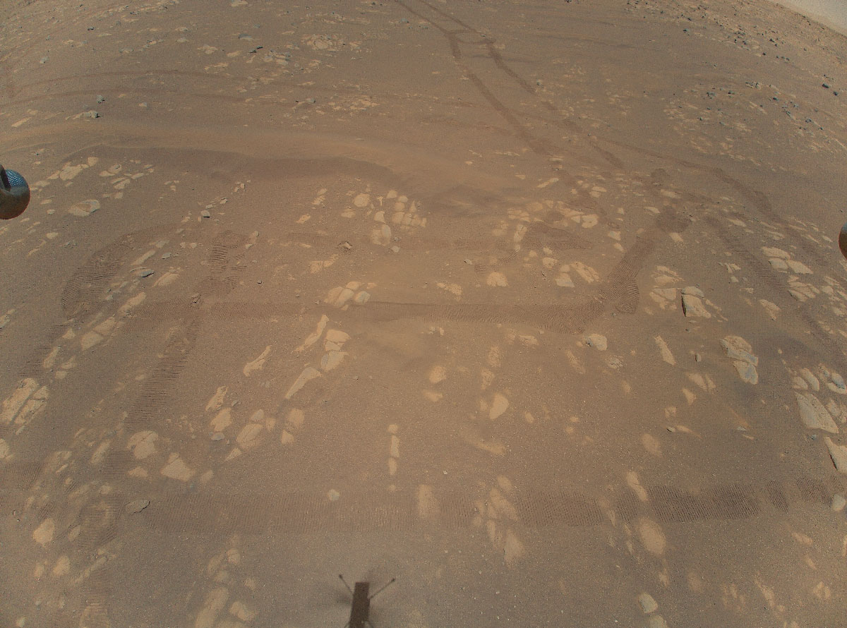 This is the first color image of the Martian surface taken by an aerial vehicle while it was aloft. The Ingenuity Mars Helicopter captured it with its color camera during its second successful flight test on April 22, 2021. At the time this image, Ingenuity was 17 feet (5.2 meters) above the surface.