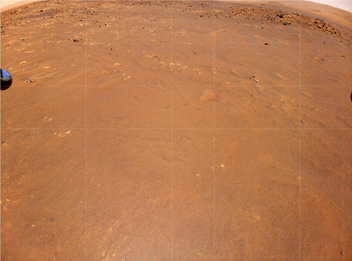 NASA’s Ingenuity Mars Helicopter took this color image during its fourth flight on April 30, 2021. “Airfield B,” it’s new landing site, can be seen below; it will seek to set down there on its fifth flight attempt.