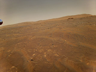 This image of Mars was taken from the height of 33 feet (10 meters) by NASA’s Ingenuity Mars helicopter during its sixth flight on May 22, 2021.