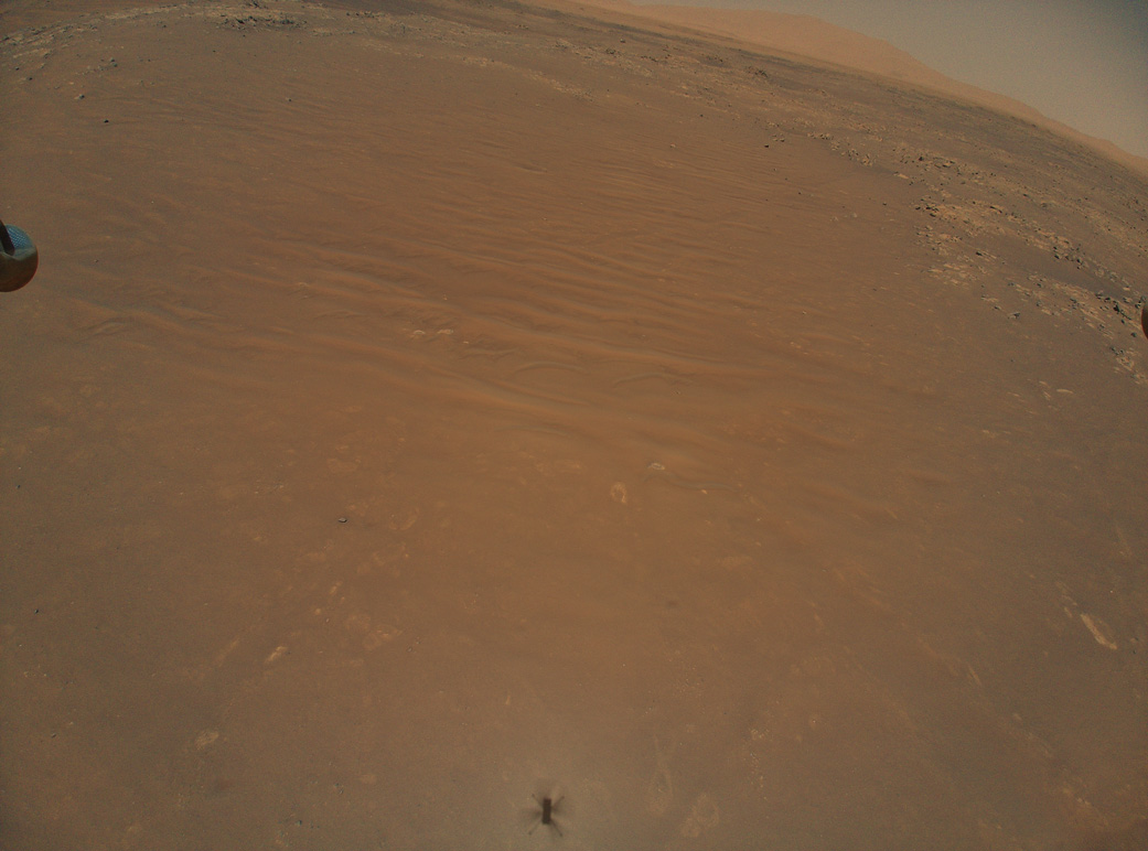 Ingenuity captured the Perseverance rover in an image taken during its 11th flight at Mars on Aug. 4.