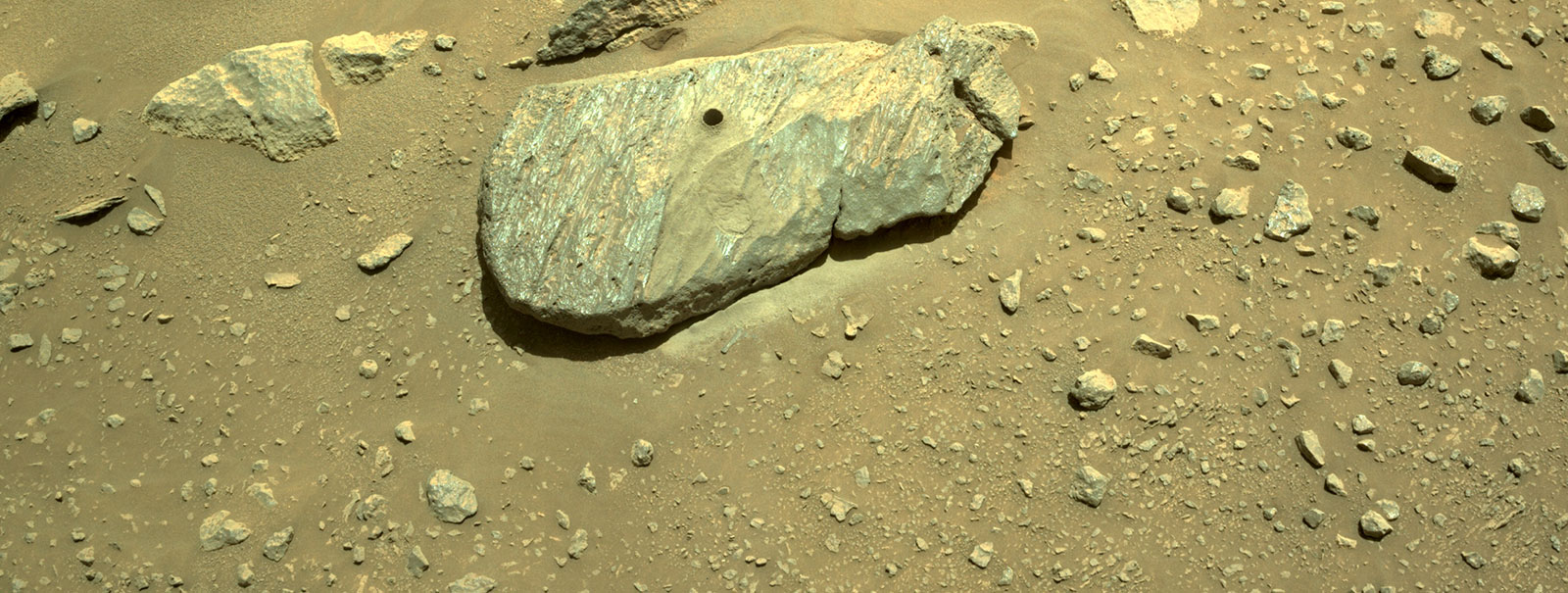 The drill hole from Perseverance's second sample-collection attempt can be seen, in this composite of two images taken on Sept. 1, by one of the rover’s navigation cameras.