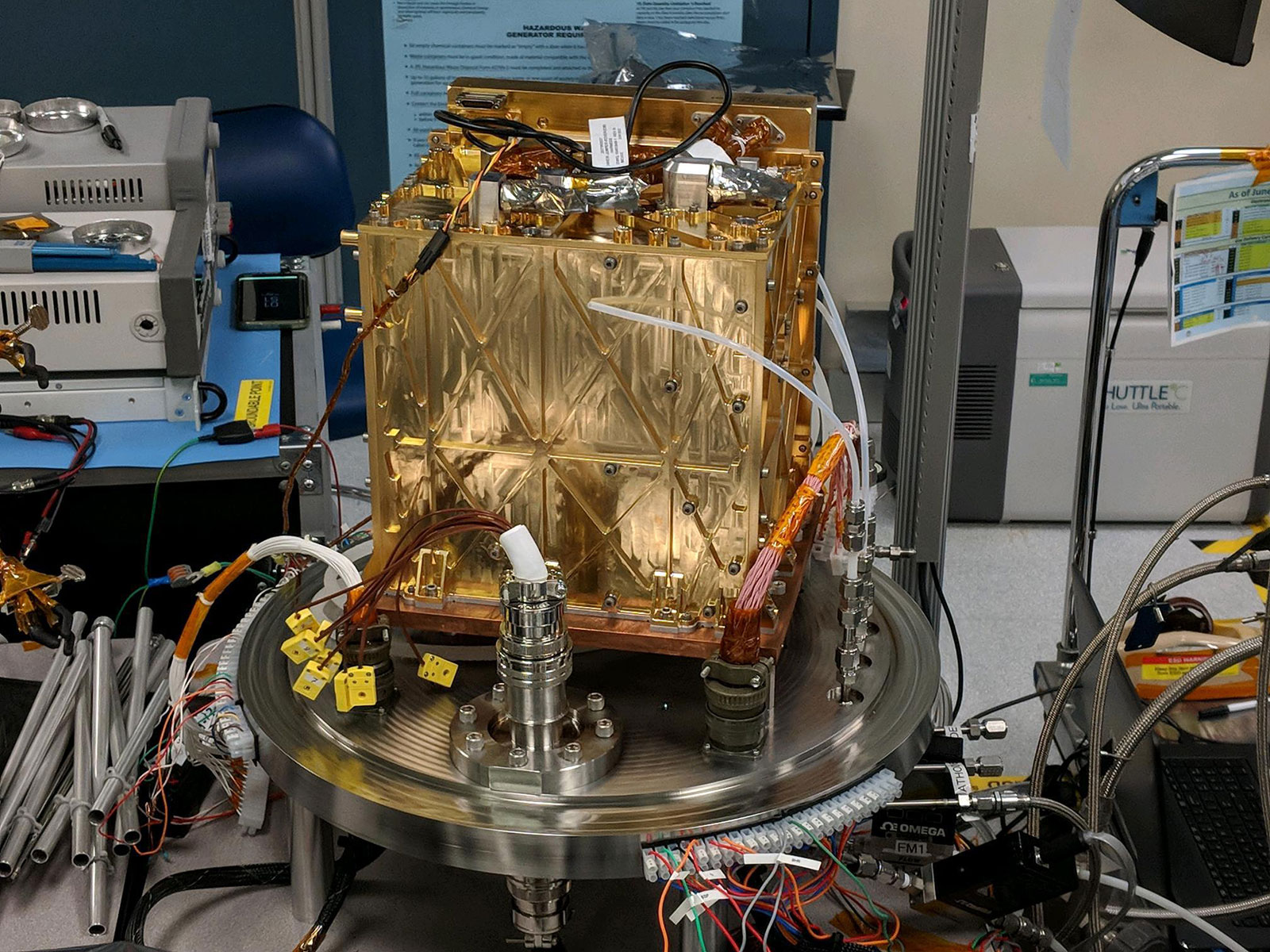 This engineering model of Mars Oxygen In-Situ Resource Utilization Experiment (MOXIE) instrument is about to undergo vibration testing in a lab at the Jet Propulsion Laboratory in Pasadena, California. Vibration tests demonstrate the ability of instruments to survive the extreme conditions of both a rocket launch from Earth and a landing on Mars.