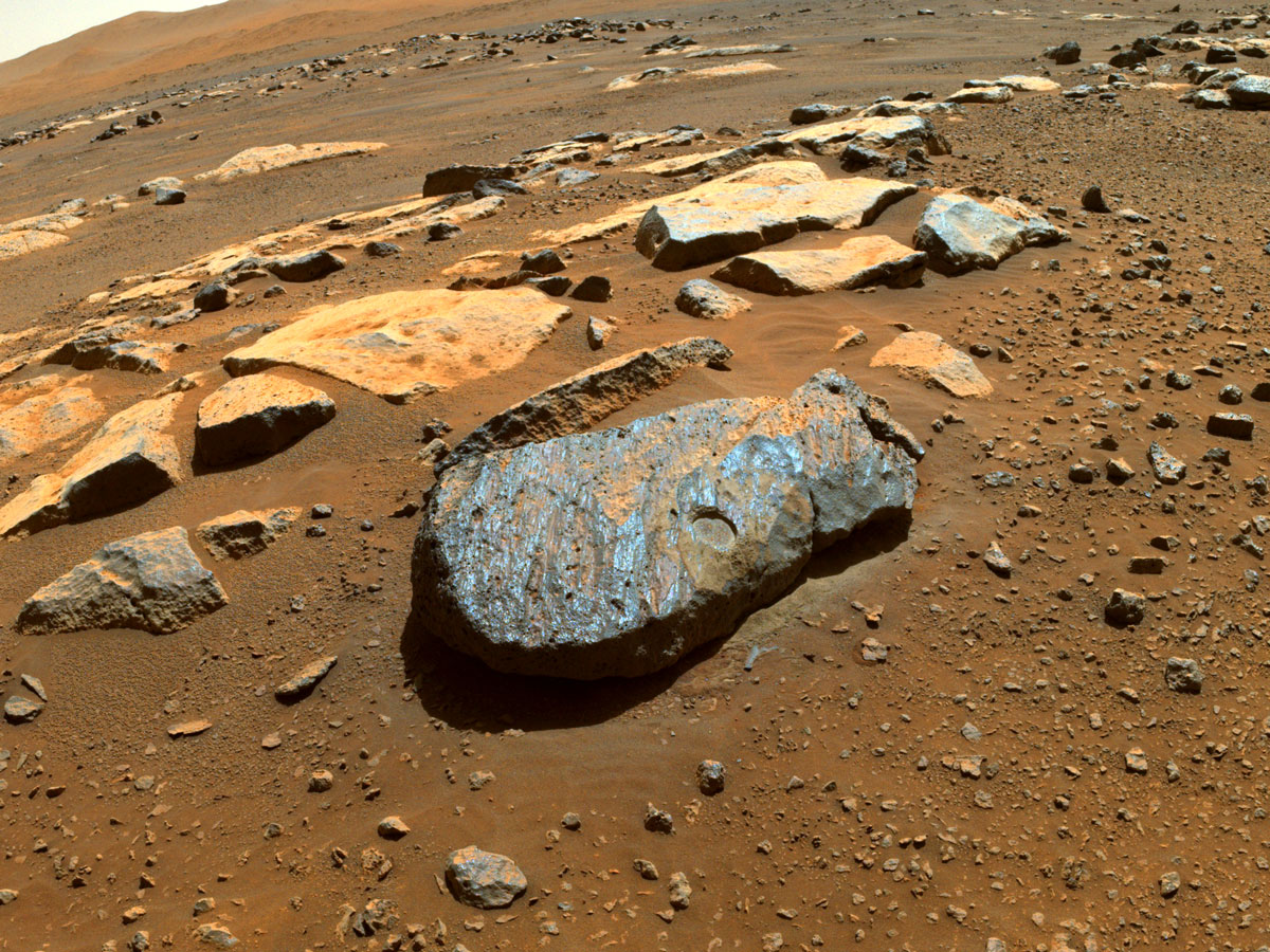 This is a colored image taken by the Perseverance rover of the Martian rock nicknamed "Rochette" after it abraded a circular patch known as "Bellegarde." The patch is about 0.39 inches (10 millimeters) deep and about 2 inches (5 centimeters) in diameter.The main image was taken by one of the rover's Hazard Avoidance Cameras. A secondary image in which part of the rover deck is visible shows the abrasion patch from the point of view of a Navigation Camera on Perseverance's mast.