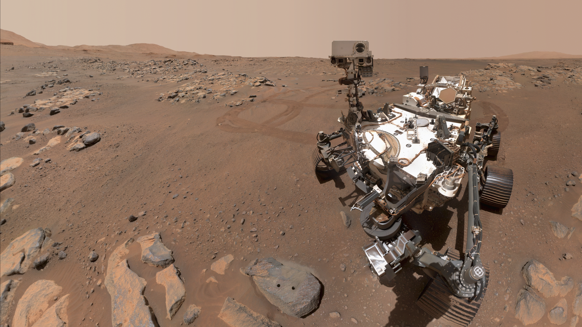 Perseverance Mars rover took a selfie over a rock with two holes where the rover used its robotic arm to drill rock core samples.