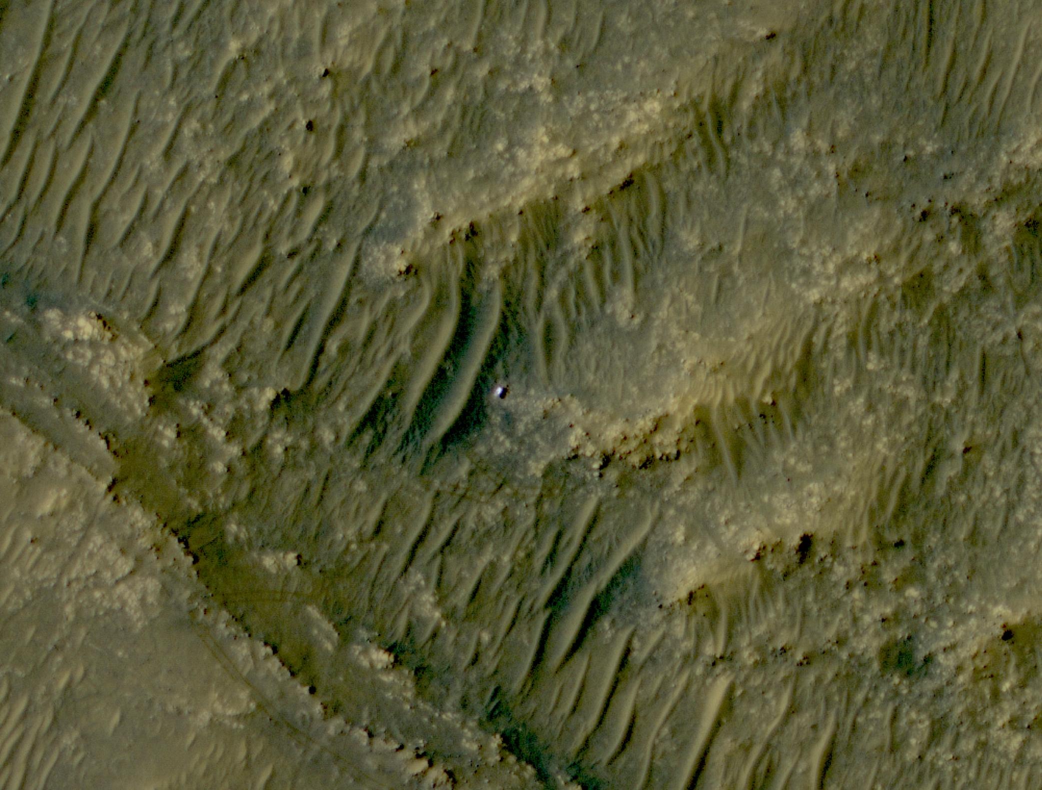 The white speck is NASA’s Perseverance rover in the “South Séítah” area of Mars’ Jezero Crater.