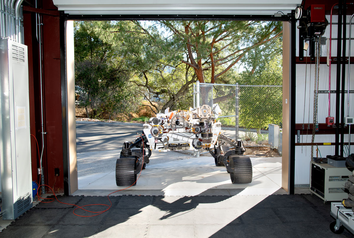 OPTIMISM faces a doorway of JPL’s Mars Yard garage shortly after arriving there on Oct. 29, 2021.