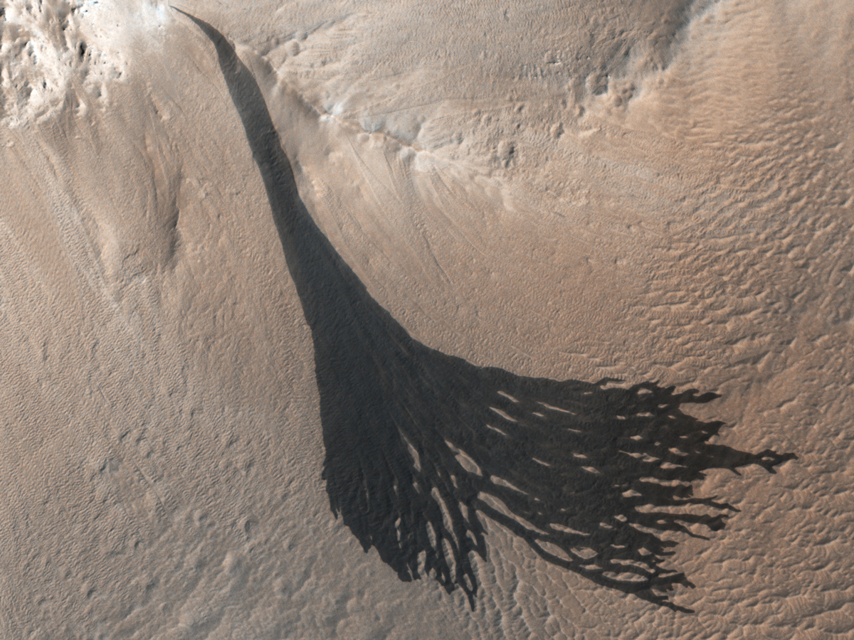 These dark streaks, also known as “slope streaks,” resulted from dust avalanches on Mars. The HiRISE camera aboard NASA’s Mars Reconnaissance Orbiter captured them on Dec. 26, 2017.