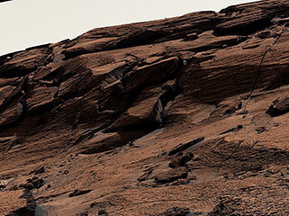 NASA’s Curiosity Mars rover used its Mast Camera, or Mastcam, to capture this mound of rock nicknamed “East Cliffs” on May 7, 2022, the 3,466th Martian day, or sol, of the mission.