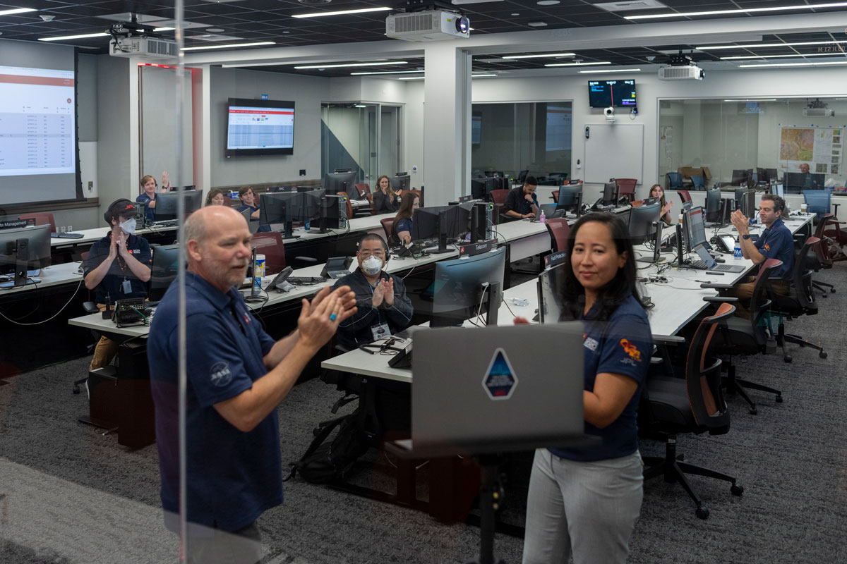 Perseverance rover team members applauded students virtually during a live video event in a mission control room at NASA's Jet Propulsion Laboratory.