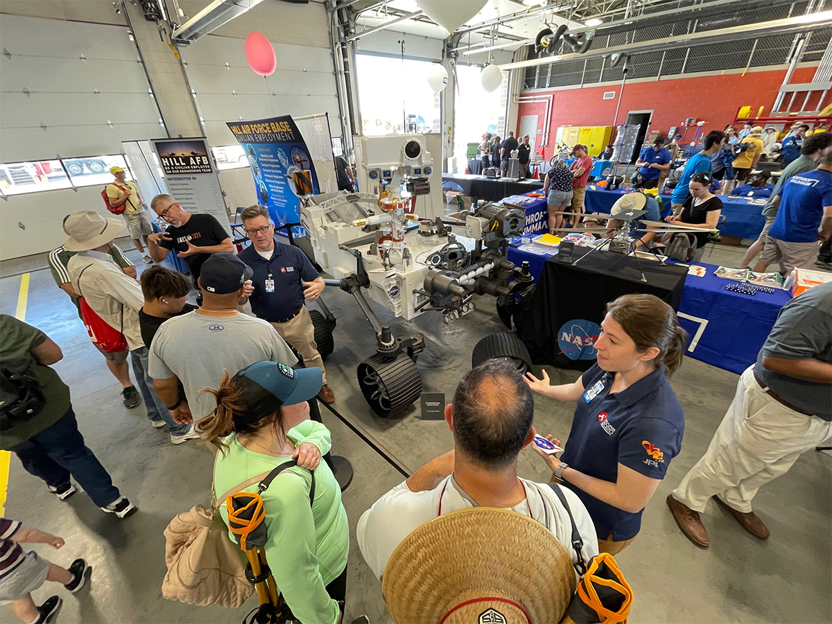 Overhead view of NASA Mars Exploration team members interacting with the public at the Utah Air Show at Hill Air Force Base June 25-26, 2022.