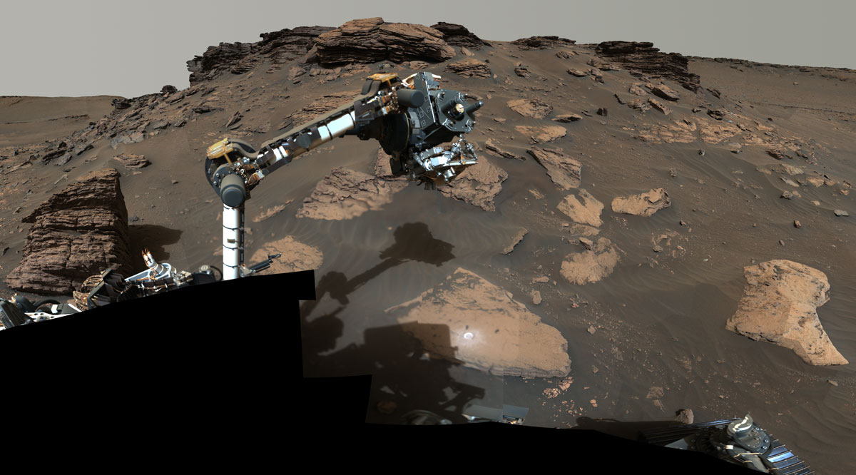 NASA’s Perseverance rover puts its robotic arm to work around a rocky outcrop called “Skinner Ridge” in Mars’ Jezero Crater.