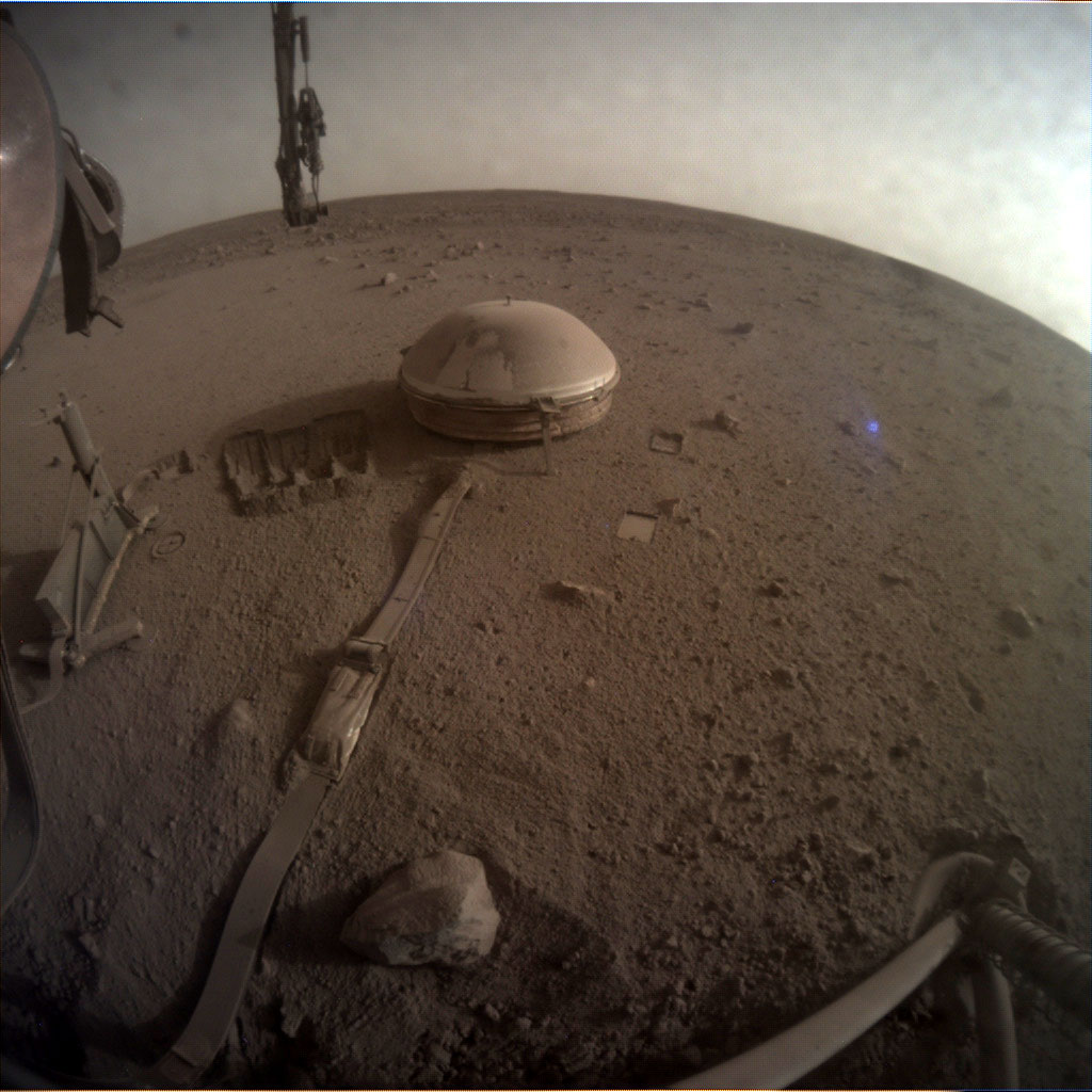 This is one of the last images ever taken by NASA’s InSight Mars lander. Captured on Dec. 11, 2022, the 1,436th Martian day, or sol, of the mission, it shows InSight’s seismometer on the Red Planet’s surface.