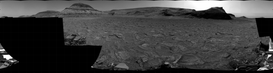 NASA's Mars rover Curiosity took 28 images in Gale Crater using its mast-mounted Right Navigation Camera (Navcam) to create this mosaic. The seam-corrected mosaic provides a 360-degree cylindrical projection panorama of the Martian surface centered at 195 degrees azimuth (measured clockwise from north). Curiosity took the images on January 18, 2023, Sol 3715 of the Mars Science Laboratory mission at drive 1676, site number 99. The local mean solar time for the image exposures was from 2 PM to 4 PM. Each Navcam image has a 45 degree field of view. CREDIT: NASA/JPL-Caltech