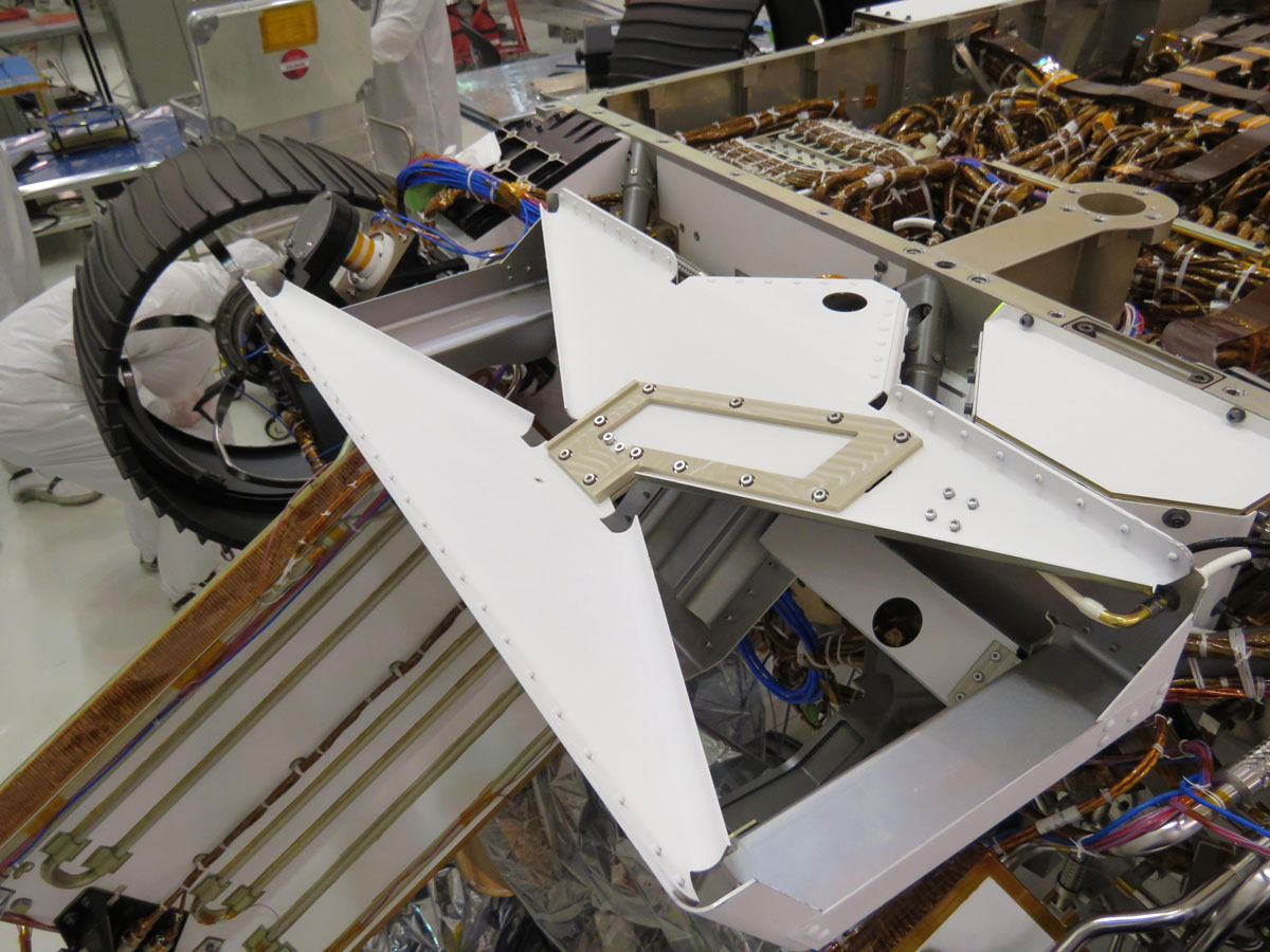 Image of bowtie-shaped antenna for the Radar Imager for Mars' Subsurface Experiment (RIMFAX) instrument mounted on the underside of the Perseverance rover.