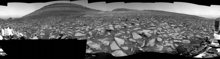 NASA's Mars rover Curiosity took 31 images in Gale Crater using its mast-mounted Right Navigation Camera (Navcam) to create this mosaic. The seam-corrected mosaic provides a 360-degree cylindrical projection panorama of the Martian surface centered at 161 degrees azimuth (measured clockwise from north). Curiosity took the images on December 20, 2023, Sol 4042 of the Mars Science Laboratory mission at drive 1030, site number 105. The local mean solar time for the image exposures was 12 PM. Each Navcam image has a 45 degree field of view. CREDIT: NASA/JPL-Caltech