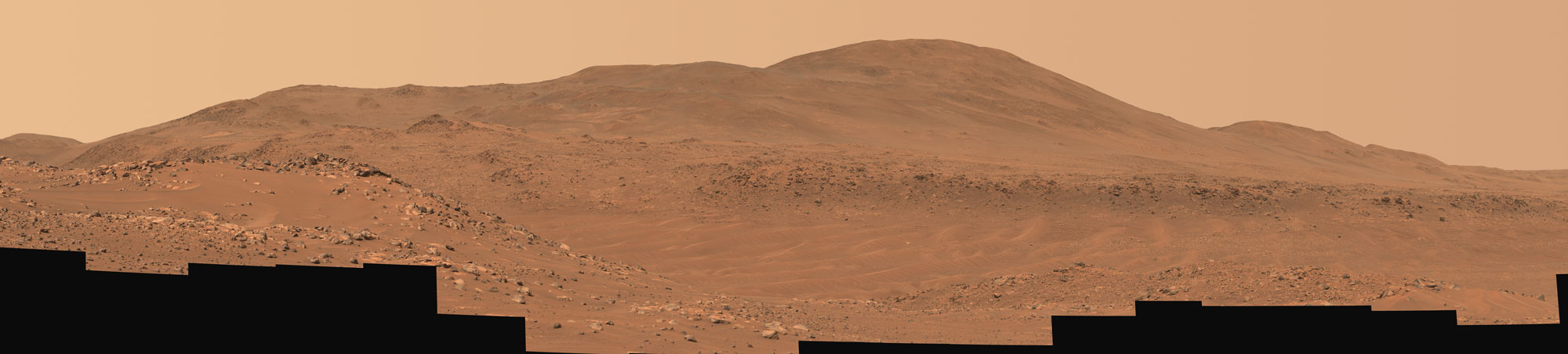 This natural-color mosaic showing NASA’s Ingenuity Mars Helicopter at “Valinor Hills” was acquired by the agency’s Perseverance Mars rover on Feb. 21, 2024, the 1,068th Martian day, or sol, of the mission.