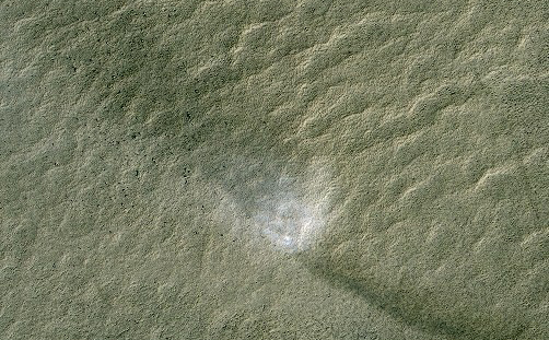 This telescopic view from orbit around Mars catches a Martian dust devil in action in the planet's southern hemisphere.