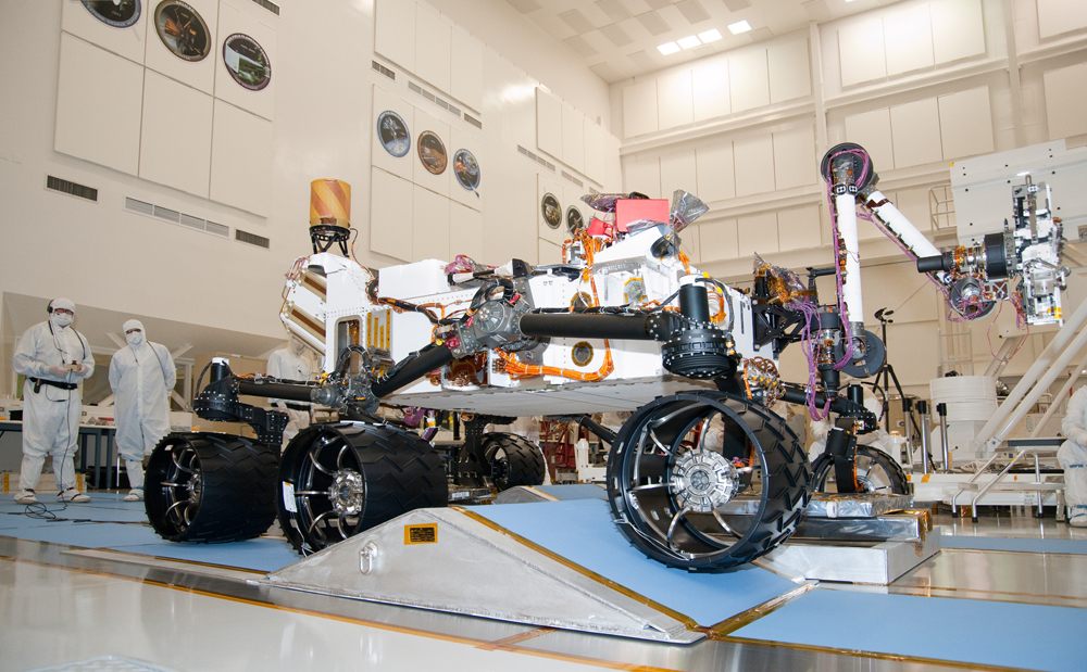 The suspension system on NASA Mars rover Curiosity easily accommodates rolling over a ramp in this Sept. 10, 2010, test drive inside the Spacecraft Assembly Facility at NASA's Jet Propulsion Laboratory, Pasadena, Calif.