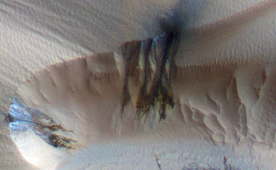 Three images of the same location taken at different times on Mars show seasonal activity causing sand avalanches and ripple changes on a Martian dune.