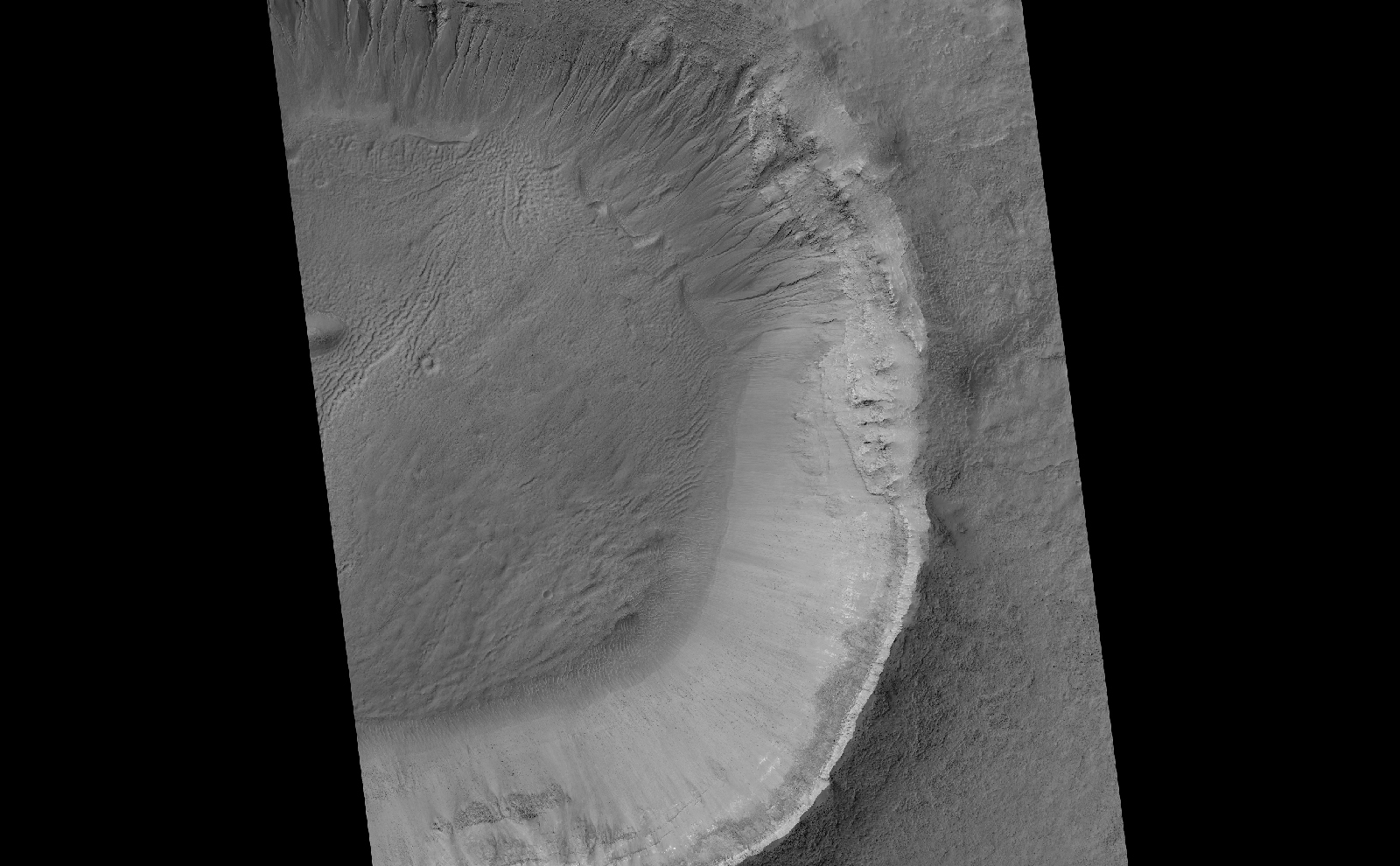 This image contrasts gullies and recurring warm-season slope flows appearing in the same crater, in the middle southern latitudes of Mars.