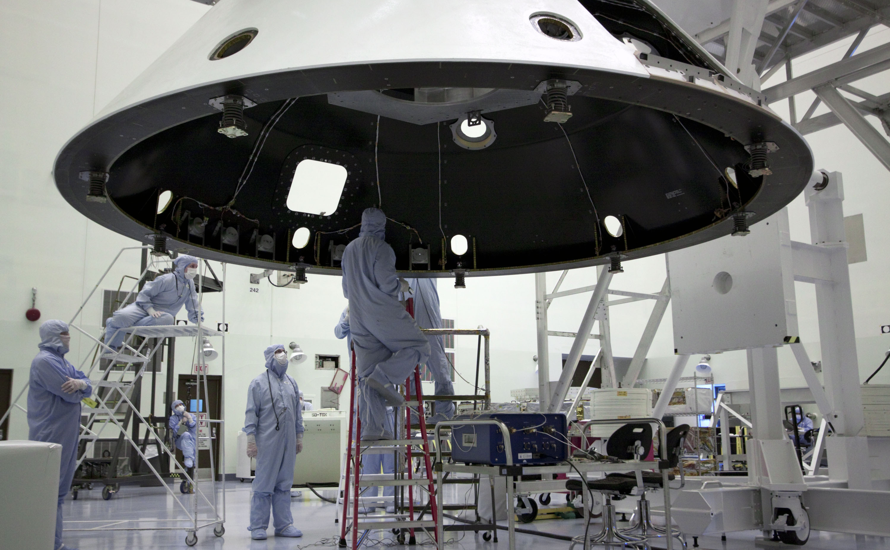 At the Payload Hazardous Servicing Facility at NASA's Kennedy Space Center in Florida, technicians process the backshell for NASA's Mars Science Laboratory (MSL).