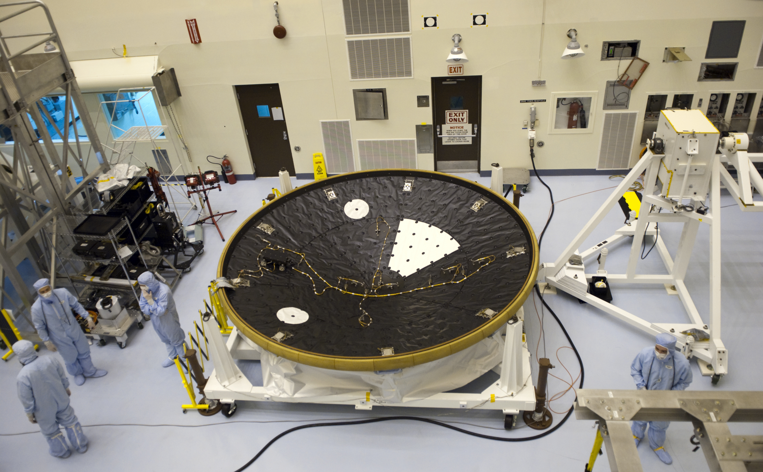 In the Payload Hazardous Servicing Facility at NASA's Kennedy Space Center in Florida, technicians process the heat shield for NASA's Mars Science Laboratory (MSL).