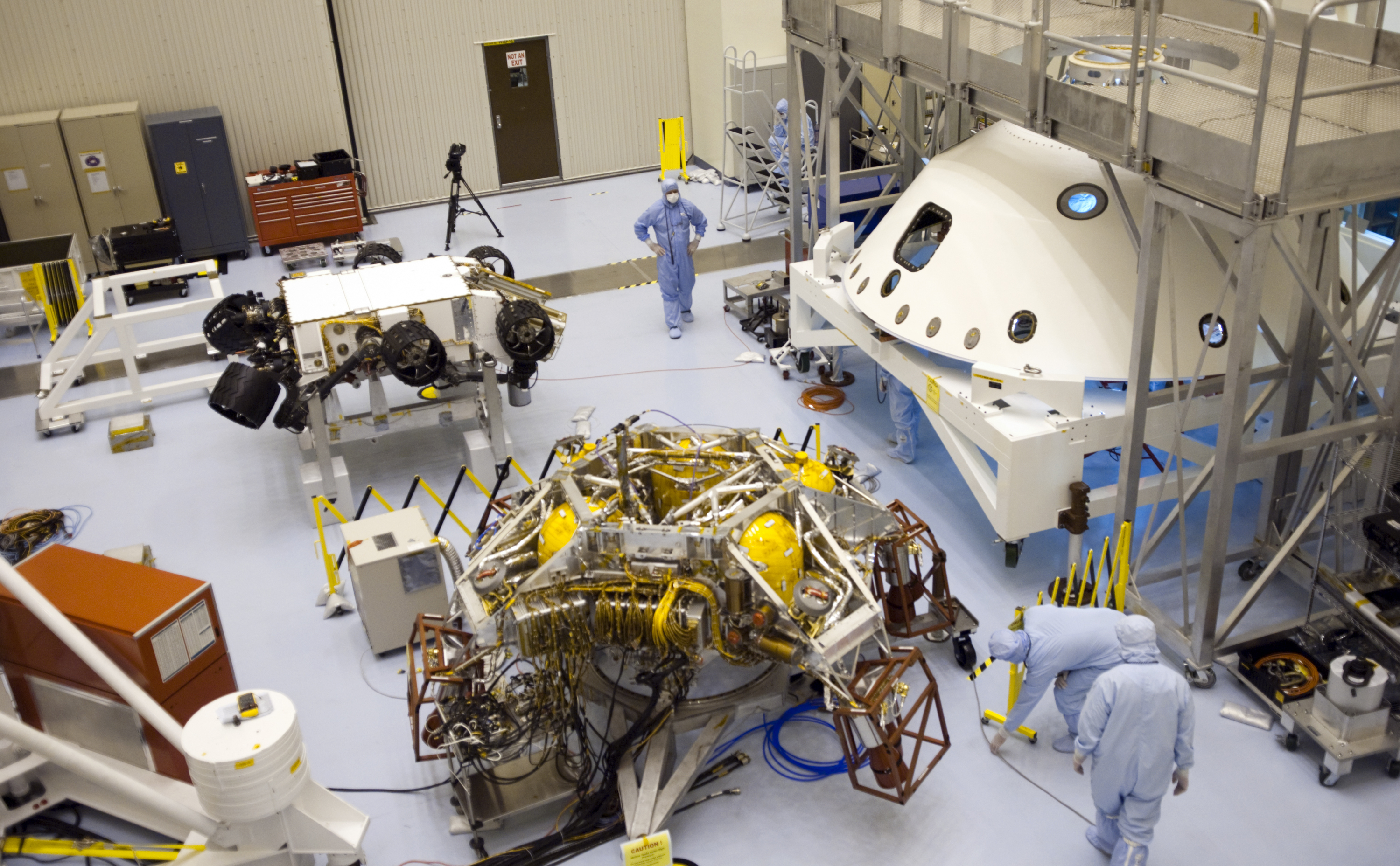 In the Payload Hazardous Servicing Facility at NASA's Kennedy Space Center in Florida, NASA's Mars Science Laboratory (MSL) rover, known as Curiosity, is being prepared to be moved to a rotation fixture for testing.