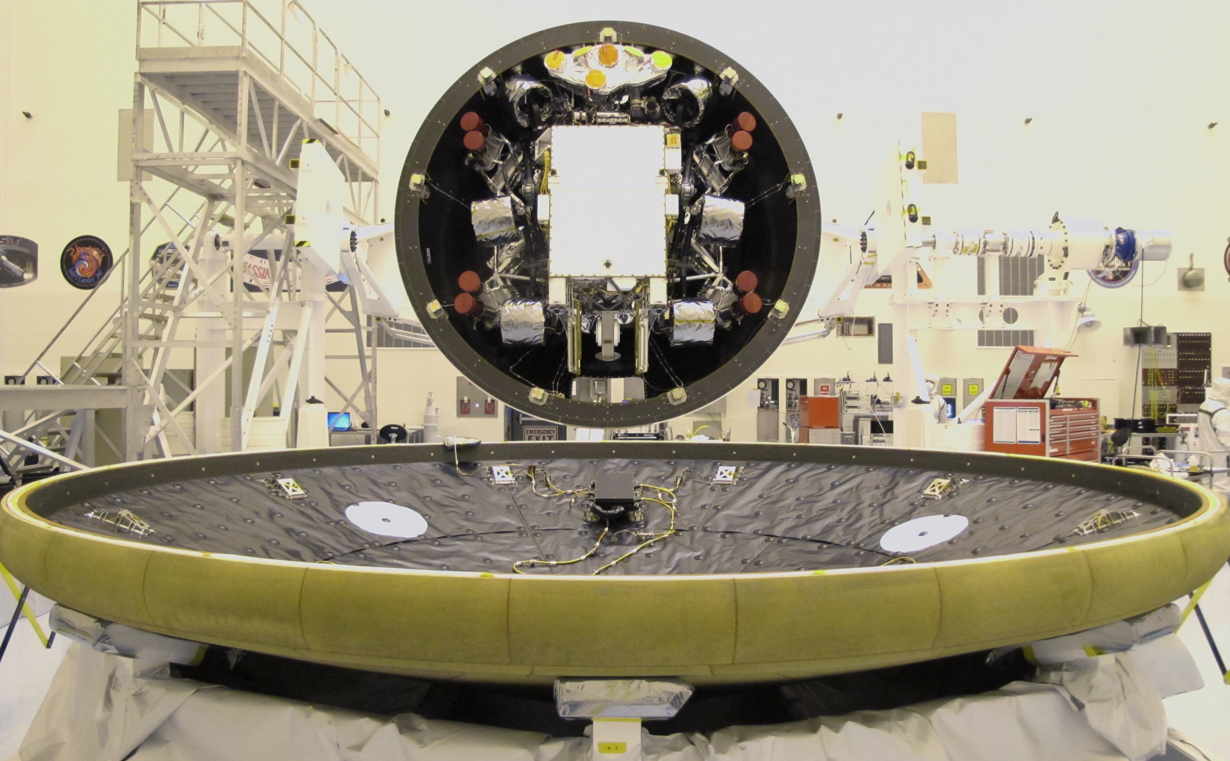 At the Payload Hazardous Servicing Facility at NASA's Kennedy Space Center in Florida, the "back shell powered descent vehicle" configuration, containing NASA's Mars Science Laboratory rover, Curiosity, is being rotated for final closeout actions.