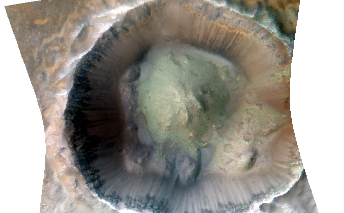 Impact cratering and erosion combine to reveal the composition of the Martian underground by exposing materials from the subsurface.