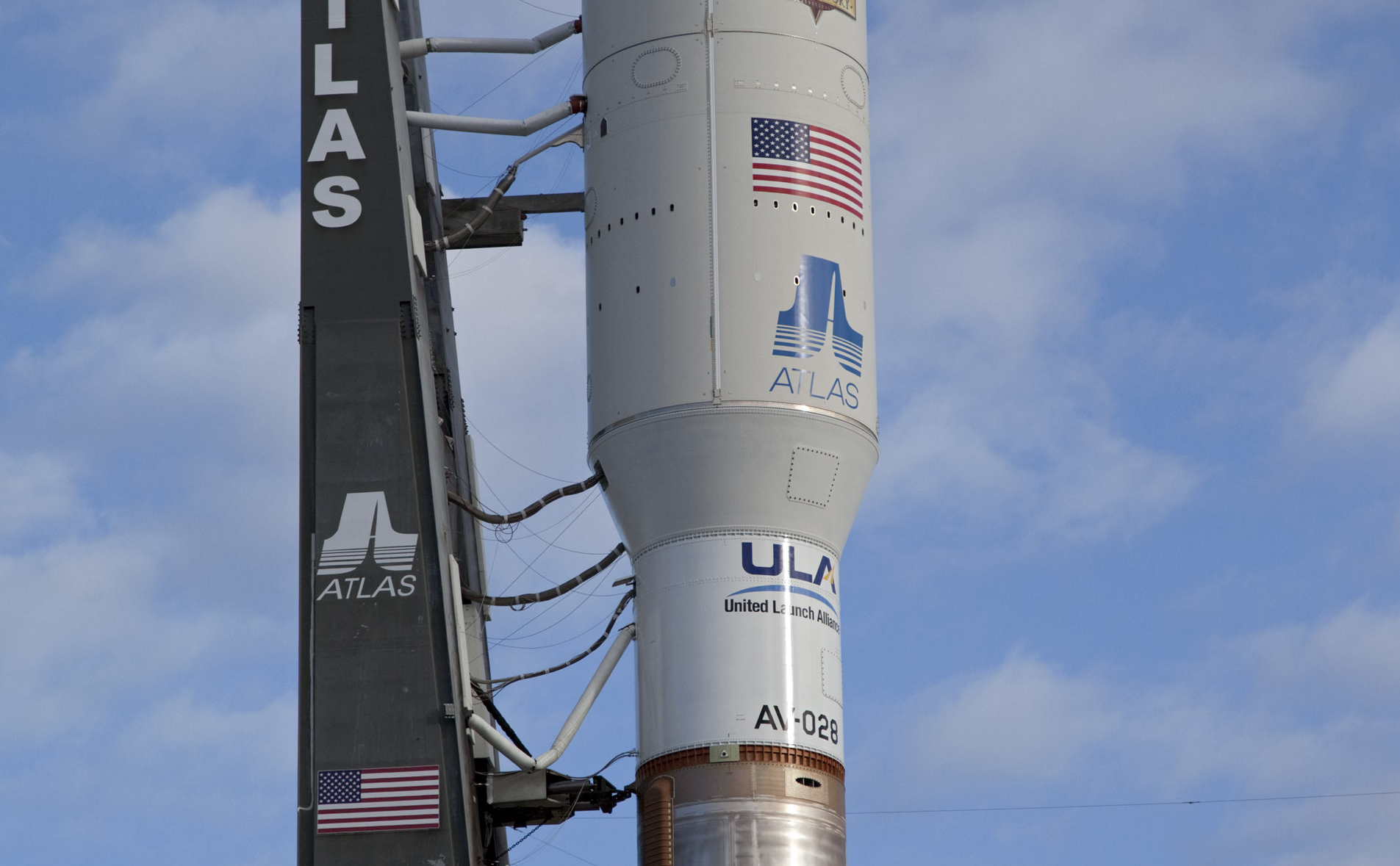 On Cape Canaveral Air Force Station in Florida, the payload fairing protecting NASA's Mars Science Laboratory (MSL) stands atop the 197-foot-tall United Launch Alliance Atlas V rocket during rollout to the launch pad at Space Launch Complex 41.