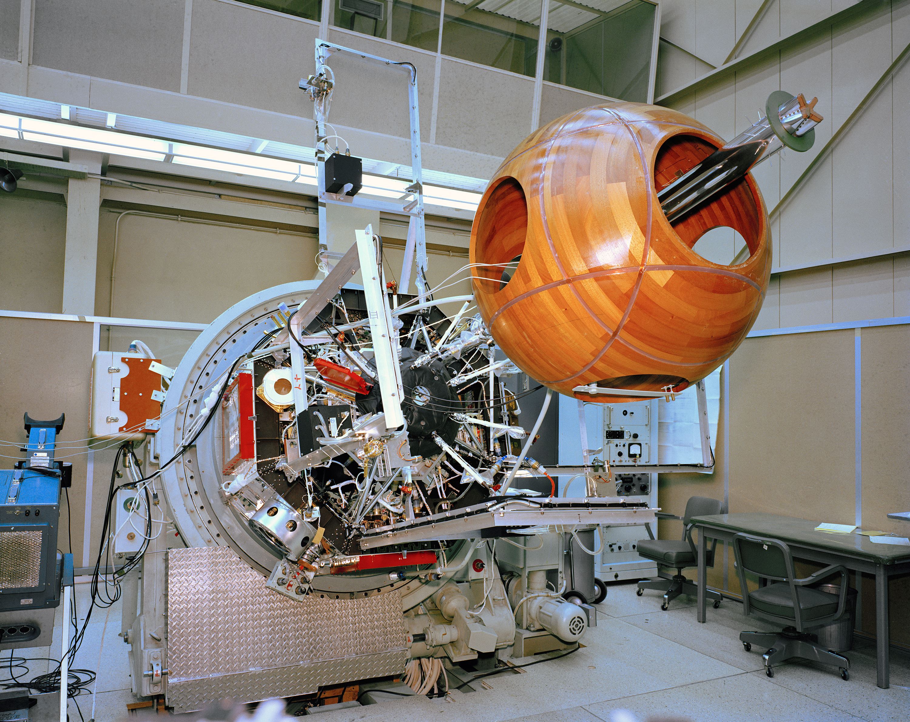 A partially assembled spacecraft in a hangar.