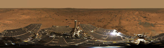 Hundreds of images taken by Spirit were combined into this 360-degree view of "Husband Hill Summit" and the rover's deck.