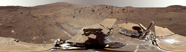 This beautiful scene reveals a tremendous amount of detail in Spirit's surroundings at a place called "Winter Haven," where the rover spent many months parked on a north-facing slope in order to keep its solar panels pointed toward the sun for the winter.  During this time, it captured several images to create this high resolution panorama.