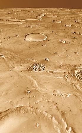 Around 200 kilometers long, Ravi Vallis was born in a flood of water from Aromatum Chaos (left). The racing waters sliced a pathway across Xanthe Terra, spawned at least two small chaos regions in the channel (center), and then hurtled over the plateau edge to disappear into another chaos region (right foreground). In the distance at left lies Orson Welles Crater and the meandering path of Shalbatana Vallis, a much longer outflow channel perhaps related hydrologically to Ravi.
