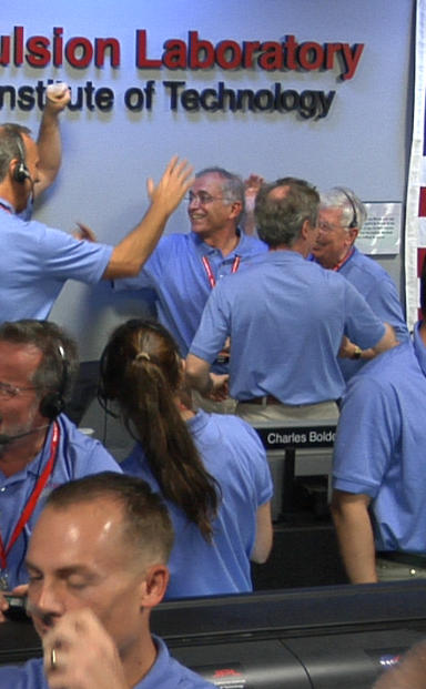 Engineers at NASA's Jet Propulsion Laboratory in Pasadena, Calif., celebrate the landing of NASA's Curiosity rover on the Red Planet. The rover touched down on Mars the evening of Aug. 5 PDT (morning of Aug. 6 EDT).