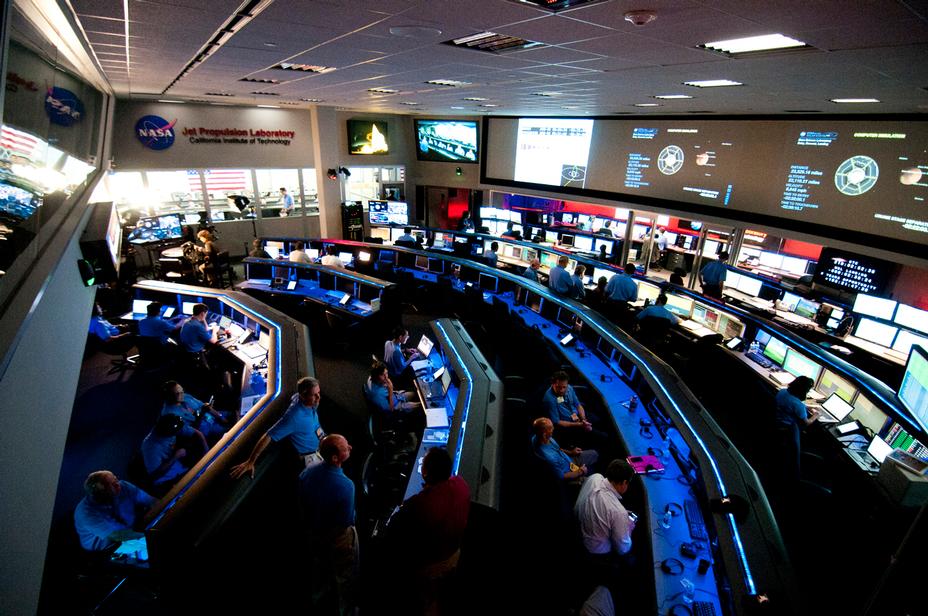 As the Curiosity rover hurdles toward Mars on the last leg of its journey, the Mars Science Laboratory Mission Operations Team assemble in Mission Control at the Space Flight Operations Facility at NASA's Jet Propulsion Laboratory in Pasadena, Calif.