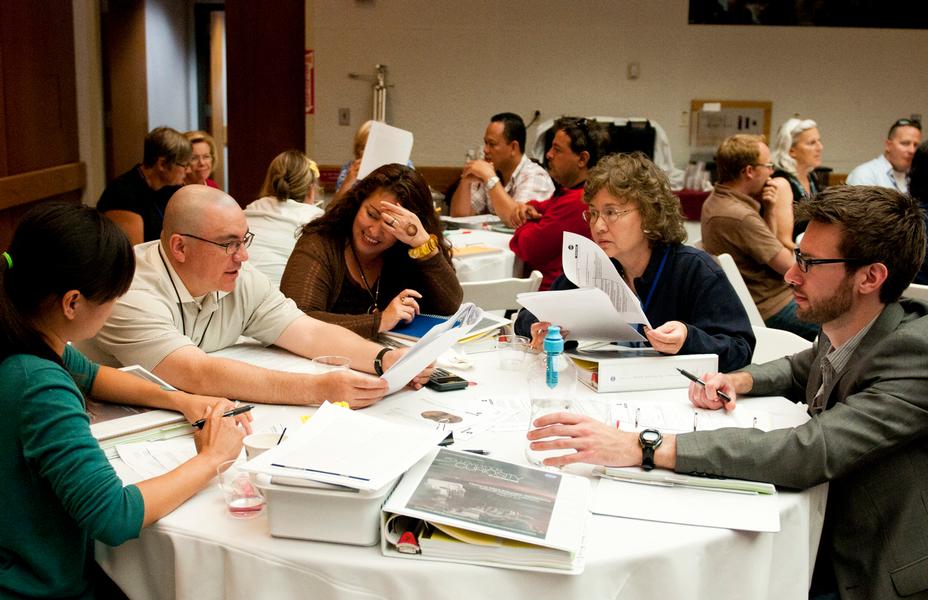 A group of teachers discusses solutions to a problem-solving activity at the Aug. 5, 2012, Curiosity Educator Workshop at NASA's Jet Propulsion Laboratory in Pasadena, Calif.