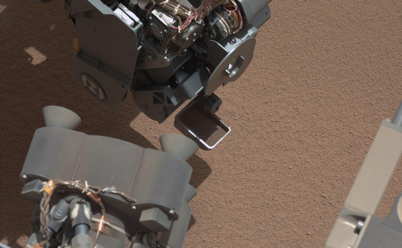 This image from the right Mast Camera (Mastcam) of NASA's Mars rover Curiosity shows a scoop full of sand and dust lifted by the rover's first use of the scoop on its robotic arm.
