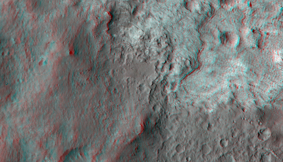 This 3D, or stereo anaglyph, view shows the upcoming science destination for NASA's Mars rover Curiosity, a region dubbed "Glenelg," where three different types of material seen from orbit come together (middle of picture).